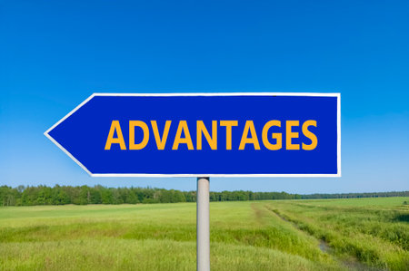 Advantages symbol. Concept word Advantages on beautiful blue road sign. Beautiful blue sky green grass and forest peaceful nature background. Business advantages concept. Copy space.の写真素材