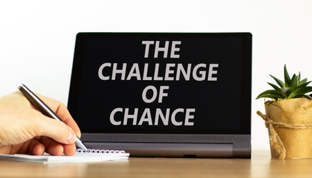The challenge of chance symbol. Concept words phrase The challenge of chance on beautiful tablet. Businessman's hand. Beautiful white background. Business The challenge of chance concept. Copy space.の写真素材