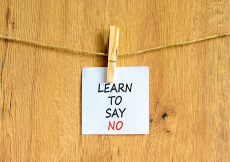 Learn to say no symbol. Concept words phrase Learn to say no on beautiful white paper on wooden...