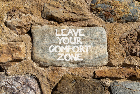 Leave your comfort zone symbol. Concept words Leave your comfort zone on beautiful gray stone wall. Beautiful stone wall background. Business psychological Leave your comfort zone concept. Copy space.の写真素材