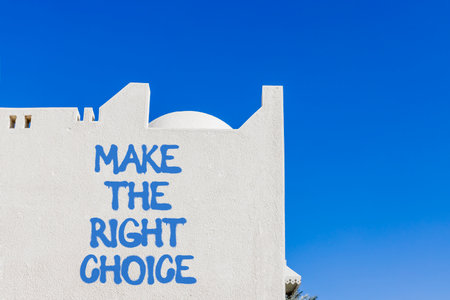 Make the right choice symbol. Concept words phrase Make the right choice on beautiful white wall. Beautiful white wall and blue sky background. Business Make the right choice concept. Copy space.の写真素材