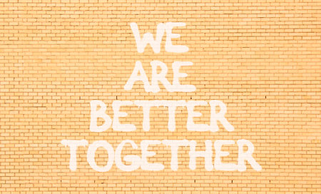 We are better together symbol. Concept words phrase We are better together on beautiful brown brick...