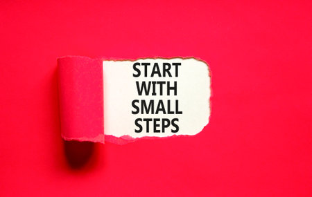 Start with small steps symbol. Concept words phrase Start with small steps on beautiful white paper....