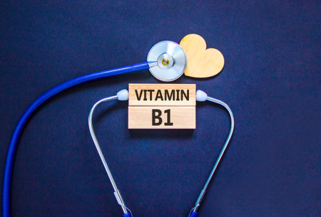 Vitamin B1 symbol. Concept words Vitamin B1 on beautiful wooden blocks. Wooden heart and stethoscope. Beautiful black background. Medical healthy lifestyle Vitamin B1 concept.の写真素材