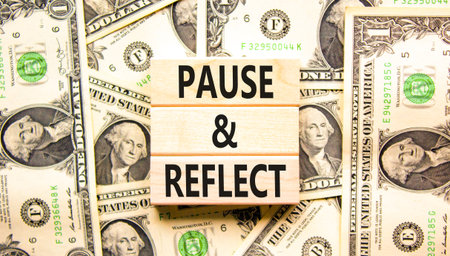Pause and reflect symbol. Concept words Pause and reflect on beautiful block. Dollar bills. Beautiful background from dollar bills. Business motivational lifestyle pause and reflect concept Copy spaceの写真素材