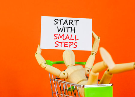 Start with small steps symbol. Concept words phrase Start with small steps on beautiful card....