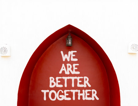 We are better together symbol. Concept words phrase We are better together on beautiful brown wall. Beautiful white wall background. Business We are better together concept. Copy space.の写真素材