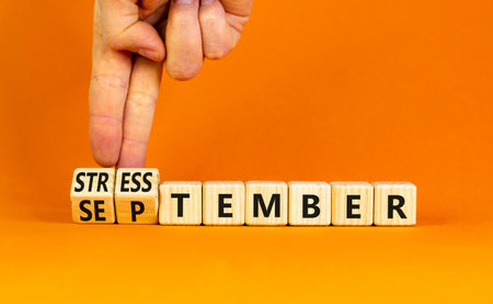 September is Stresstember symbol. Concept words September is Stresstember on beautiful wooden blocks. Beautiful orange table orange background. Business September is Stresstember concept. Copy space.の写真素材