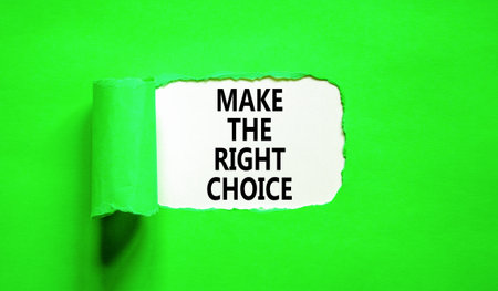 Make the right choice symbol. Concept words phrase Make the right choice on beautiful white paper. Beautiful green paper background. Business Make the right choice concept. Copy space.の写真素材