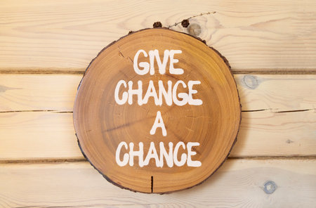 Give change a chance symbol. Concept words phrase Give change a chance on beautiful wooden circle. Beautiful wooden wall background. Business motivational Give change a chance concept. Copy space.の写真素材