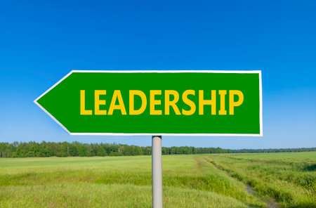 Leadership symbol. Concept word Leadership on beautiful green road sign. Beautiful blue sky green grass and forest peaceful nature background. Business leadership concept. Copy space.の写真素材