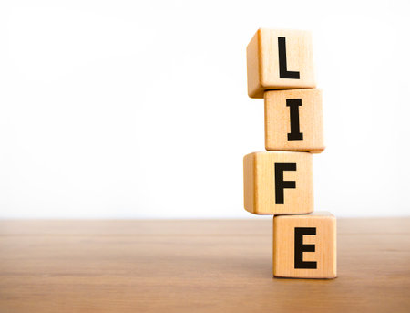 Life symbol. Concept word Life on beautiful wooden blocks. Beautiful wooden table white background. Business, lifestyle, support and life concept. Copy space.の写真素材