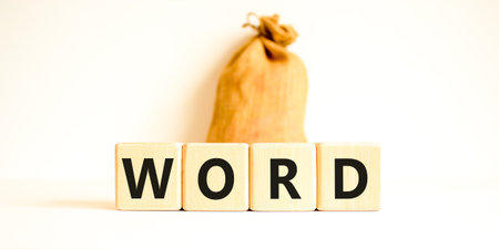 Word symbol. Concept word Word on beautiful wooden blocks. Beautiful canvas bag. Beautiful white table white background. Business, lifestyle, support and word concept. Copy space.の写真素材