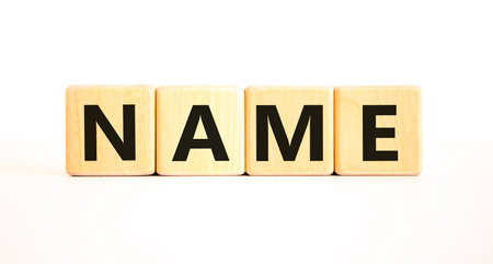 Name symbol. Concept word Name on beautiful wooden blocks. Beautiful white table white background. Business, lifestyle, support and name concept. Copy space.の写真素材