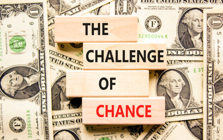 The challenge of chance symbol. Concept words phrase The challenge of chance on beautiful blocks. Dollar bills. Beautiful dollar bills background. Business The challenge of chance concept. Copy space.の写真素材