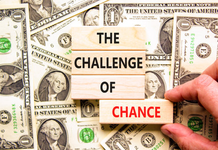 The challenge of chance symbol. Concept words phrase The challenge of chance on beautiful blocks. Dollar bills. Beautiful dollar bills background. Business The challenge of chance concept. Copy space.の写真素材