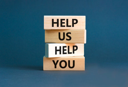Help you symbol. Concept words phrase Help us help you on beautiful wooden blocks. Beautiful gray paper background. Business Help you concept. Copy space.の写真素材