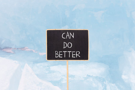 Can do better symbol. Concept words Can do better on beautiful blackboard. Beautiful blue ice and snow background. Business and can do better concept. Copy space.の写真素材
