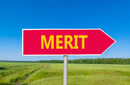 Merit symbol. Concept word Merit on beautiful red road sign. Beautiful blue sky green grass and forest peaceful nature background. Business lifestyle merit concept. Copy space.の写真素材