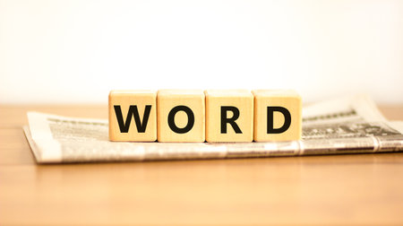 Word symbol. Concept word Word on beautiful wooden blocks on newspaper. Beautiful wooden table white background. Business, lifestyle, support and word concept. Copy space.の写真素材
