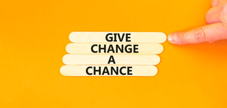 Give change a chance symbol. Concept words phrase Give change a chance on beautiful wooden stick....