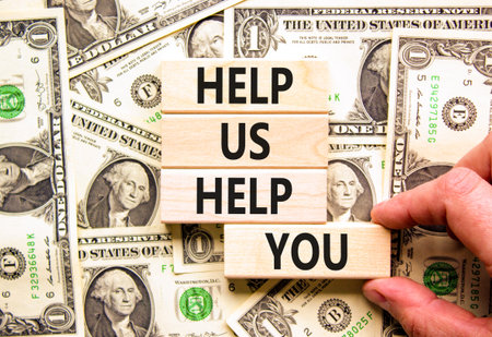 Help you symbol. Concept words phrase Help us help you on beautiful wooden blocks. Dollar bills....