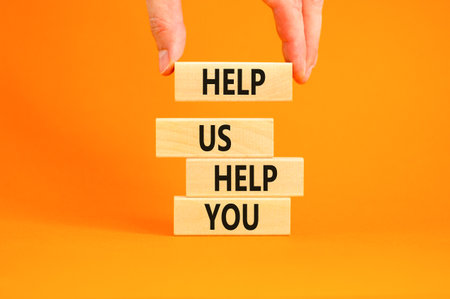 Help you symbol. Concept words phrase Help us help you on beautiful wooden blocks. Beautiful orange...