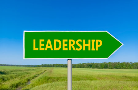 Leadership symbol. Concept word Leadership on beautiful green road sign. Beautiful blue sky green grass and forest peaceful nature background. Business leadership concept. Copy space.の写真素材