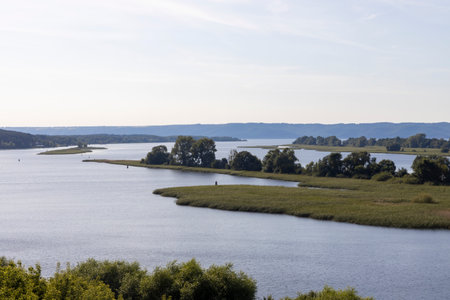 Russian landscape with Volga river on a sunny day. Bolgar, Tatarstan, Russia. View on the valley of Volga river from the hill. Peaceful nature. Beautiful background.の写真素材