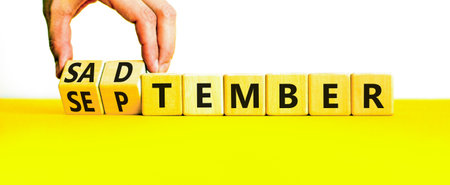 September is Sadtember symbol. Concept words September is Sadtember on wooden blocks. White...