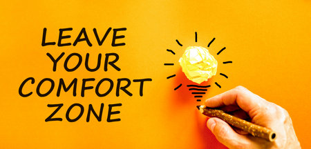 Leave your comfort zone symbol. Concept words Leave your comfort zone on beautiful orange paper....