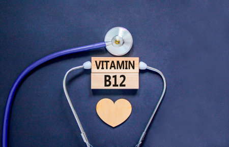 Vitamin B12 symbol. Concept words Vitamin B12 on beautiful wooden blocks. Wooden heart and...