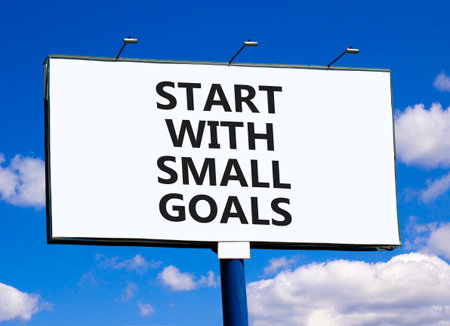 Start with small goals symbol. Concept words phrase Start with small goals on beautiful big white...