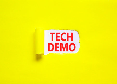 Tech demo symbol. Concept word Tech demo on beautiful white paper. Beautiful yellow paper...
