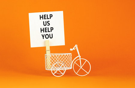Help you symbol. Concept words phrase Help us help you on beautiful white paper on wooden...