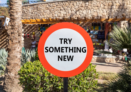 Try something new symbol. Concept words Try something new on beautiful big white road sign....