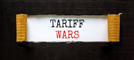 Trade tariff wars symbol. Concept word Tariff wars on beautiful white paper. Beautiful black paper...