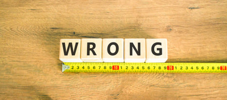 Wrong symbol. Concept word Wrong on beautiful wooden blocks. Beautiful wooden table wooden...