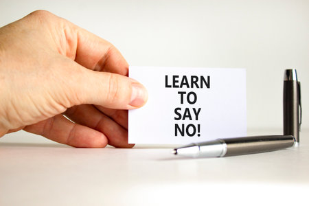 Learn to say no symbol. Concept words phrase Learn to say no on beautiful white card. Businessman's...
