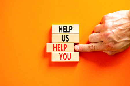 Help you symbol. Concept words phrase Help us help you on beautiful wooden blocks. Beautiful orange...