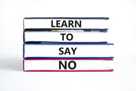 Learn to say no symbol. Concept words phrase Learn to say no on beautiful books. Beautiful white paper background. Business psychological Learn to say no concept. Copy space.の写真素材