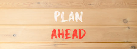 Plan ahead symbol. Concept word Plan ahead on beautiful wooden wall. Beautiful wooden wall background. Business plan ahead concept. Copy space.の写真素材