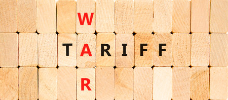 Trade tariff war symbol. Concept word Tariff war on beautiful wooden block wall. Beautiful wooden block wall background. Wooden blocks. Business trade tariff wars concept. Copy space.の写真素材