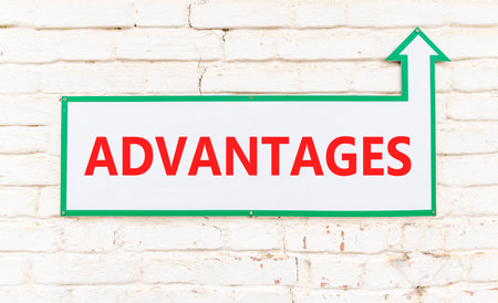 Advantages symbol. Concept word Advantages on beautiful white sign on old white brick wall....