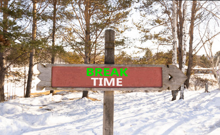 Break time symbol. Concept Break word time on beautiful wooden road sign. Beautiful snow winter forest background. Business break time concept. Copy space.の写真素材