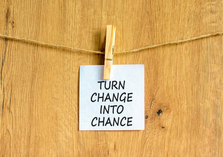 Turn change into chance symbol. Concept words phrase Turn change into chance on beautiful white...