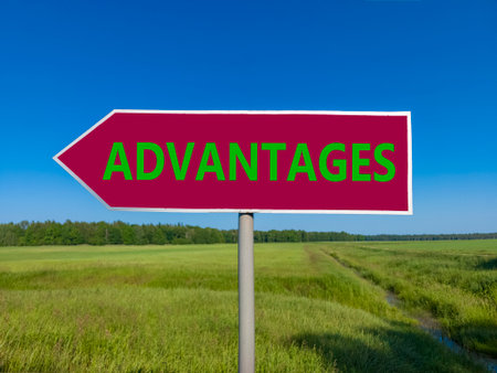Advantages symbol. Concept word Advantages on beautiful red road sign. Beautiful blue sky green...