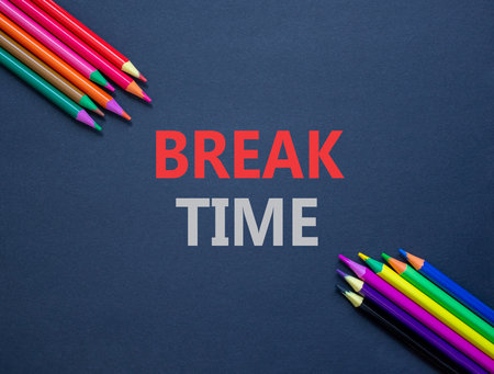Break time symbol. Concept Break word time on beautiful black paper. Colored pencils. Beautiful black paper background. Business break time concept. Copy space.の写真素材
