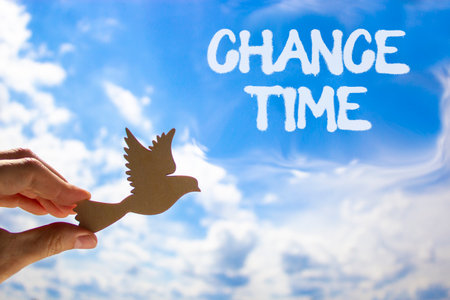 Chance time symbol. Concept word Chance time on beautiful blue sky. Businessman's hand with wooden...