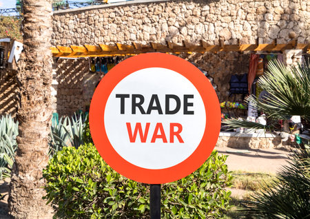 Trade war symbol. Concept word Trade war on beautiful red and white road sign. Beautiful palm tree...